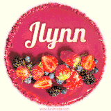 Beautifully decorated red velvet berry birthday cake with vibrant fruits and a glowing 'Jlynn' name, adding a touch of sweetness and sparkle.