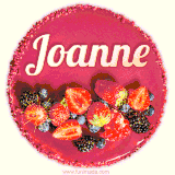 Beautifully decorated red velvet berry birthday cake with vibrant fruits and a glowing 'Joanne' name, adding a touch of sweetness and sparkle.