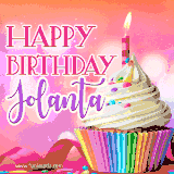 A vibrant birthday GIF featuring a rainbow-colored cupcake topped with white frosting, sprinkles, and a lit candle. The text reads 'Happy Birthday Jolanta' in bold pink and violet letters with white outline.