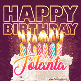 A colorful birthday cake topped with lit candles, with the words 'Happy Birthday Jolanta' in bold glowing letters on a burgundy background. Animated flames add a festive touch.