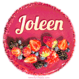 Beautifully decorated red velvet berry birthday cake with vibrant fruits and a glowing 'Joleen' name, adding a touch of sweetness and sparkle.