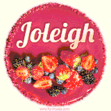 Beautifully decorated red velvet berry birthday cake with vibrant fruits and a glowing 'Joleigh' name, adding a touch of sweetness and sparkle.