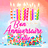 A white birthday cake covered in colorful sprinkles, topped with bright candles, and French text 'Bon Anniversaire Jolie' on a pastel gradient background in an animated GIF.