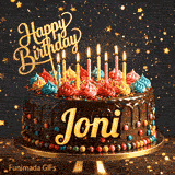 A gourmet chocolate cake on a stand with burning candles and a gold Happy Birthday topper, made for Joni.