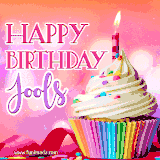 A vibrant birthday GIF featuring a rainbow-colored cupcake topped with white frosting, sprinkles, and a lit candle. The text reads 'Happy Birthday Jools' in bold pink and violet letters with white outline.