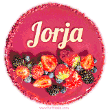 Beautifully decorated red velvet berry birthday cake with vibrant fruits and a glowing 'Jorja' name, adding a touch of sweetness and sparkle.