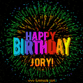 A colorful animated GIF featuring the text 'Happy Birthday Jory!' in rainbow colors with a dynamic iridescent firework display in the background.