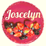 Beautifully decorated red velvet berry birthday cake with vibrant fruits and a glowing 'Joscelyn' name, adding a touch of sweetness and sparkle.