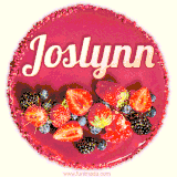 Beautifully decorated red velvet berry birthday cake with vibrant fruits and a glowing 'Joslynn' name, adding a touch of sweetness and sparkle.