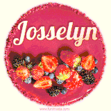 Beautifully decorated red velvet berry birthday cake with vibrant fruits and a glowing 'Josselyn' name, adding a touch of sweetness and sparkle.