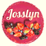 Beautifully decorated red velvet berry birthday cake with vibrant fruits and a glowing 'Josslyn' name, adding a touch of sweetness and sparkle.