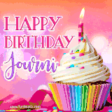 A vibrant birthday GIF featuring a rainbow-colored cupcake topped with white frosting, sprinkles, and a lit candle. The text reads 'Happy Birthday Journi' in bold pink and violet letters with white outline.