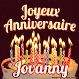 A Happy Birthday GIF in French featuring a festive birthday cake adorned with bright candles and the glowing text 'Joyeux Anniversaire Jovanny' in a cheerful style.
