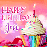 A vibrant birthday GIF featuring a rainbow-colored cupcake topped with white frosting, sprinkles, and a lit candle. The text reads 'Happy Birthday Jovi' in bold pink and violet letters with white outline.