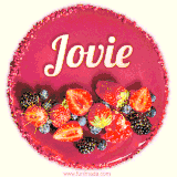 Beautifully decorated red velvet berry birthday cake with vibrant fruits and a glowing 'Jovie' name, adding a touch of sweetness and sparkle.