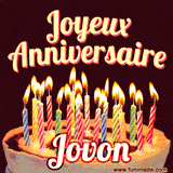 A Happy Birthday GIF in French featuring a festive birthday cake adorned with bright candles and the glowing text 'Joyeux Anniversaire Jovon' in a cheerful style.