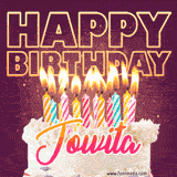 A colorful birthday cake topped with lit candles, with the words 'Happy Birthday Jowita' in bold glowing letters on a burgundy background. Animated flames add a festive touch.