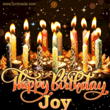 A glowing personalized birthday GIF with name Joy featuring lit candles with intricate designs, warm lighting, and the text 'Happy Birthday' in an elegant font.