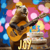 Animated birthday GIF showing a capybara playing guitar and singing beside a birthday cake with the name Joy in large letters and colorful bokeh lights in the background.