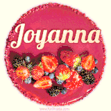 Beautifully decorated red velvet berry birthday cake with vibrant fruits and a glowing 'Joyanna' name, adding a touch of sweetness and sparkle.