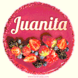 Beautifully decorated red velvet berry birthday cake with vibrant fruits and a glowing 'Juanita' name, adding a touch of sweetness and sparkle.
