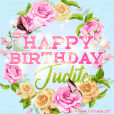 A charming animated GIF featuring 'Happy Birthday Judite' in pink and green text, surrounded by delicate roses, leaves, and fluttering butterflies on a soft light blue pastel background.