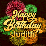 Golden text reading 'Happy Birthday Judith' surrounded by vibrant fireworks in red, green, and yellow, set against a dark background in this celebratory birthday GIF.