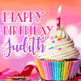 A vibrant birthday GIF featuring a rainbow-colored cupcake topped with white frosting, sprinkles, and a lit candle. The text reads 'Happy Birthday Judith' in bold pink and violet letters with white outline.