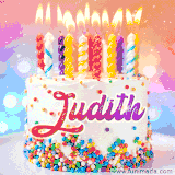 A cheerful white birthday cake with multicolor sprinkles, lit candles, and 'Judith' written in vibrant letters, in an animated GIF.