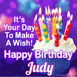 A colorful birthday GIF for Judy featuring a cupcake with vibrant lit candles and the text 'It's Your Day to Make a Wish! Happy Birthday Judy' in bold letters on a festive purple background.
