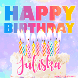 A vibrant animated name GIF with the words 'Happy Birthday Juliska' with colorful candles on a creamy cake. The background sparkles with pastel shades, adding a festive touch.
