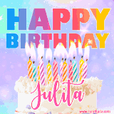 A vibrant animated name GIF with the words 'Happy Birthday Julita' with colorful candles on a creamy cake. The background sparkles with pastel shades, adding a festive touch.