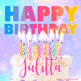 A vibrant animated name GIF with the words 'Happy Birthday Julitta' with colorful candles on a creamy cake. The background sparkles with pastel shades, adding a festive touch.