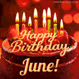 Beautifully decorated red velvet berry birthday cake with vibrant fruits and a glowing 'June' name, adding a touch of sweetness and sparkle.