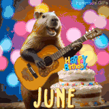 Animated birthday GIF showing a capybara playing guitar and singing beside a birthday cake with the name June in large letters and colorful bokeh lights in the background.