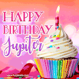 A vibrant birthday GIF featuring a rainbow-colored cupcake topped with white frosting, sprinkles, and a lit candle. The text reads 'Happy Birthday Jupiter' in bold pink and violet letters with white outline.