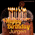 A rich chocolate cake topped with glowing birthday candles and surrounded by bright fireworks. The animated GIF displays the message 'Happy Birthday Jurgen' in golden text.