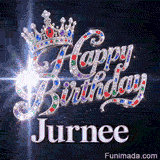 A detailed silver queen crown with colorful gemstone highlights resting on diamond-encrusted cursive letters.Jurnee