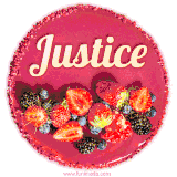 Beautifully decorated red velvet berry birthday cake with vibrant fruits and a glowing 'Justice' name, adding a touch of sweetness and sparkle.