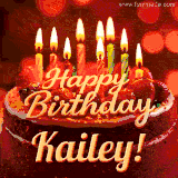 Beautifully decorated red velvet berry birthday cake with vibrant fruits and a glowing 'Kailey' name, adding a touch of sweetness and sparkle.