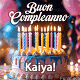 Birthday cake topped with pink and yellow lit candles, surrounded by glowing bokeh lights and party balloons. The greeting 'Buon Compleanno Kaiya GIF!' is displayed.