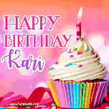 A vibrant birthday GIF featuring a rainbow-colored cupcake topped with white frosting, sprinkles, and a lit candle. The text reads 'Happy Birthday Kari' in bold pink and violet letters with white outline.