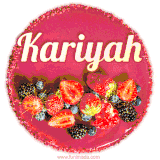 Beautifully decorated red velvet berry birthday cake with vibrant fruits and a glowing 'Kariyah' name, adding a touch of sweetness and sparkle.