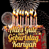 A chocolate birthday cake with glowing candles, the German text 'Alles Gute zum Geburtstag Kariyah,' and vibrant fireworks lighting up the background in an animated GIF.