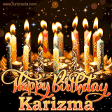 A glowing personalized birthday GIF with name Karizma featuring lit candles with intricate designs, warm lighting, and the text 'Happy Birthday' in an elegant font.