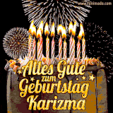 A chocolate birthday cake with glowing candles, the German text 'Alles Gute zum Geburtstag Karizma,' and vibrant fireworks lighting up the background in an animated GIF.