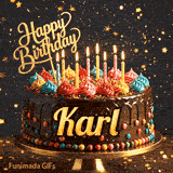 Close-up of a chocolate birthday cake with multicolored frosting swirls and colorful candy beads around the gold base. Greeting text with name Karl