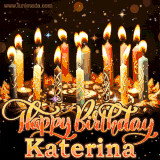 A glowing personalized birthday GIF with name Katerina featuring lit candles with intricate designs, warm lighting, and the text 'Happy Birthday' in an elegant font.