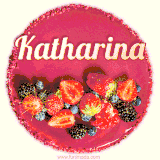 Beautifully decorated red velvet berry birthday cake with vibrant fruits and a glowing 'Katharina' name, adding a touch of sweetness and sparkle.