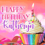 A vibrant birthday GIF featuring a rainbow-colored cupcake topped with white frosting, sprinkles, and a lit candle. The text reads 'Happy Birthday Katheryn' in bold pink and violet letters with white outline.